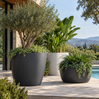 Large outdoor plastic planters in charcoal and white with ornamental plants